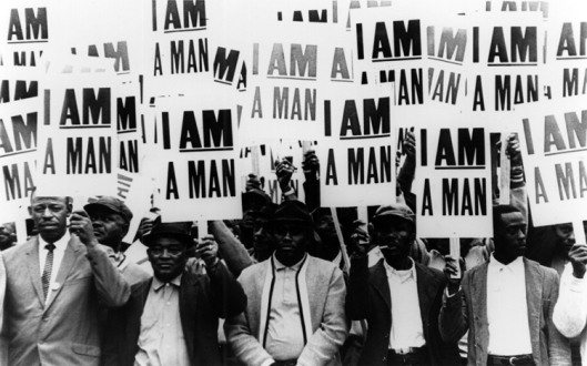 Striking members of Memphis Local 1733 hold signs whose slogan symbolized the sanitation workers' 1968 campaign, March 1968. (Richard L. Copley/http://dlxs.lib.wayne.edu/).